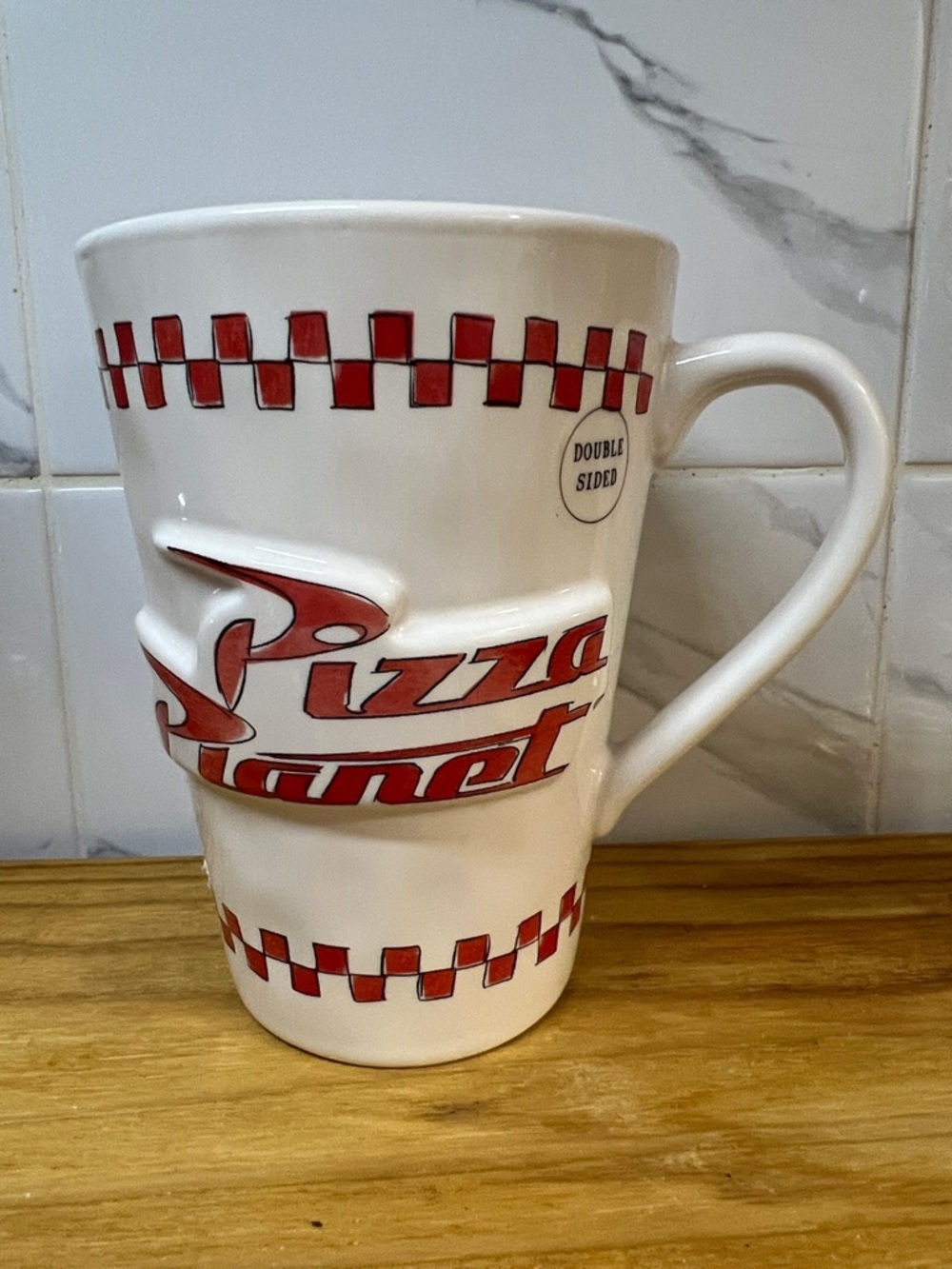 Rae Dunn White Ceramic Mug with Red Checkerboard & Pizza Planet Logo